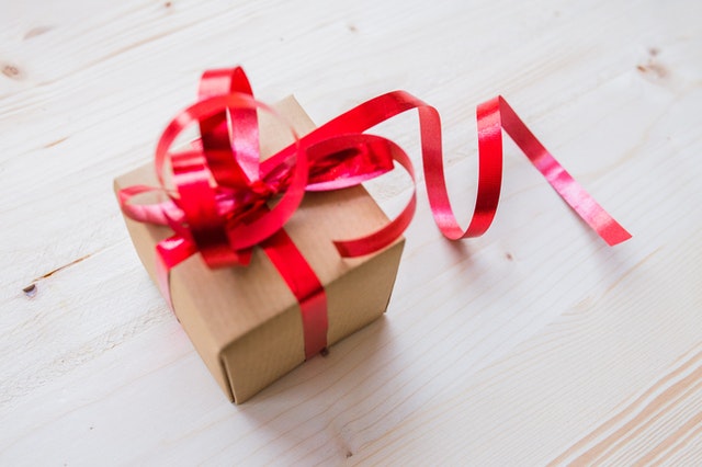 red-ribbon-on-brown-cardboard-box-192538.jpg